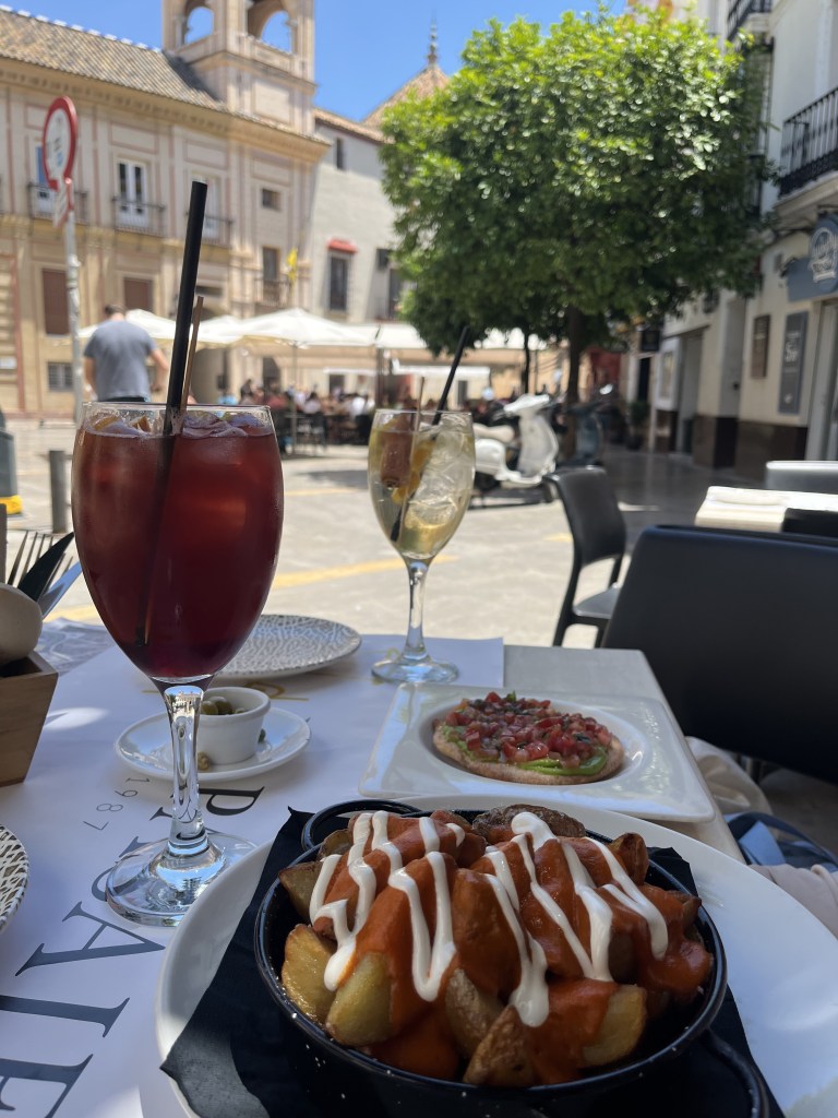 Sangria and patatas bravos on a Spansih street
