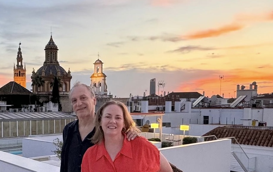 Man and woman on rooftop bar in Seville