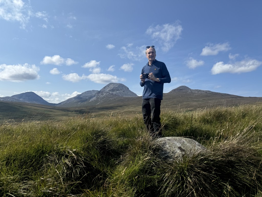 Man in hilly landscape