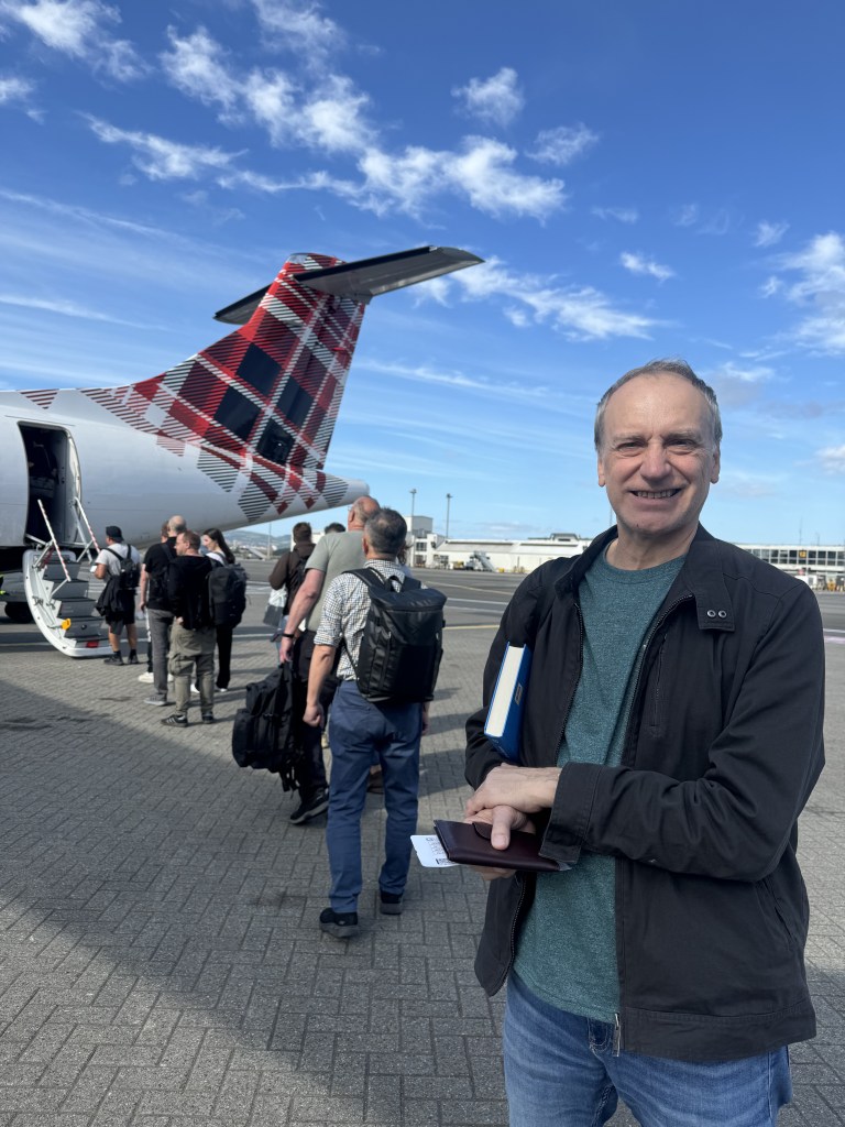 Man boarding Loganair flight