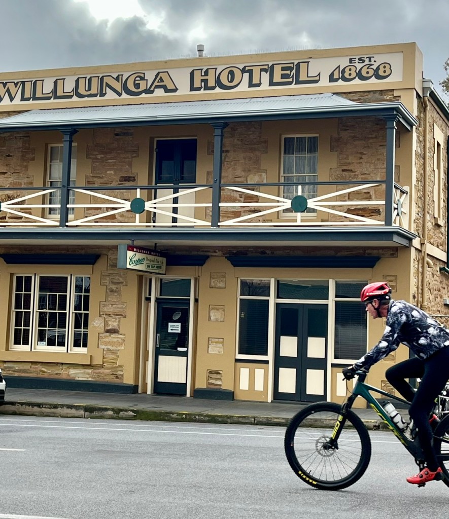 Willunga Hotel, heritage front with a racing cyclist in the foreground